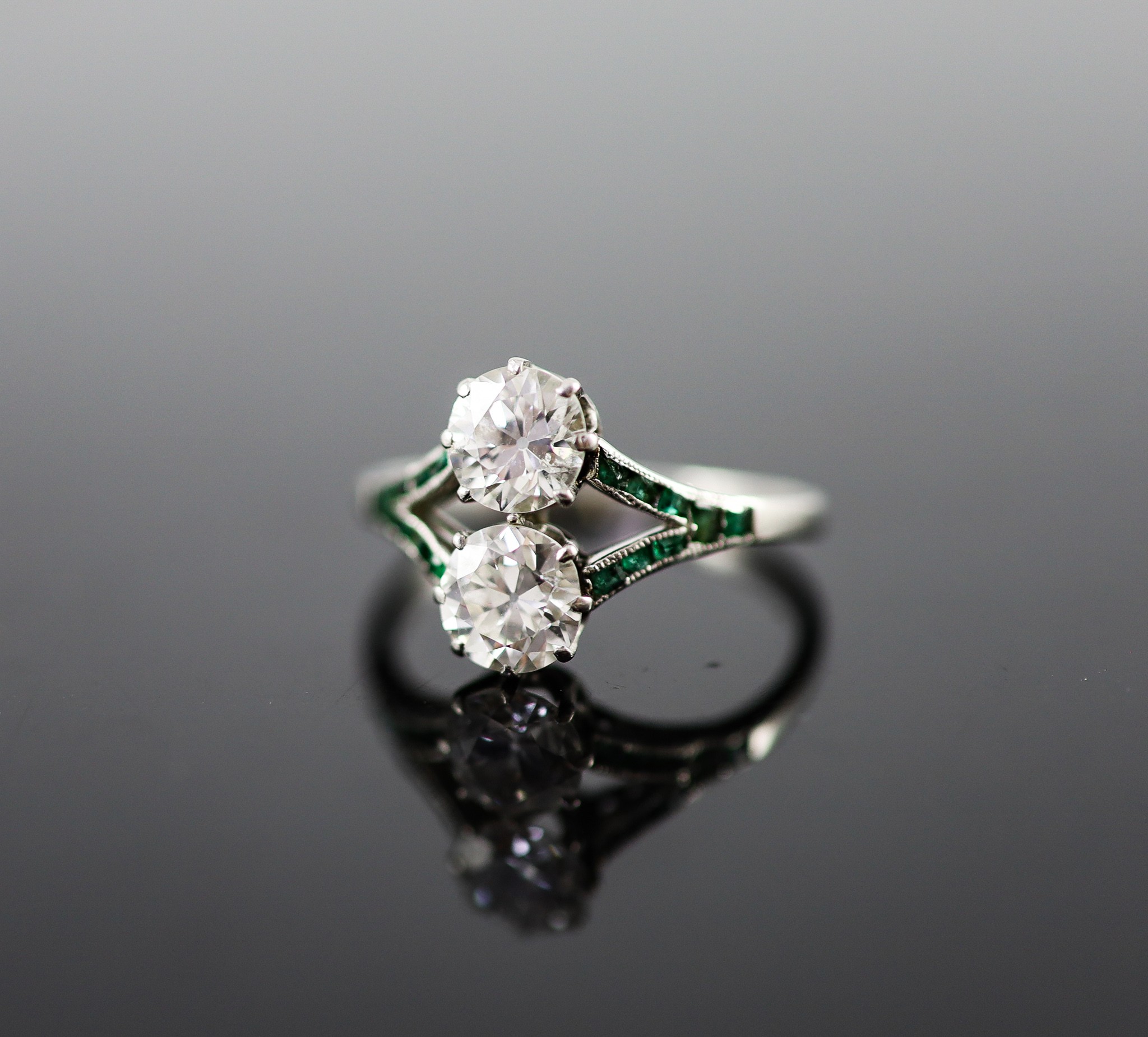 A 1920's platinum and two stone diamond ring
